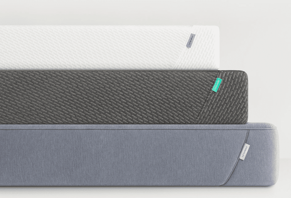The three Tuft and Needle mattress models stacked on top of each other against a blank background.