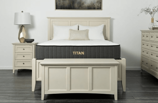 A Titan mattress in a neutral colored room.