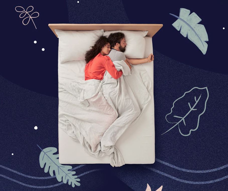 A couple sleeping on a white Casper mattress.