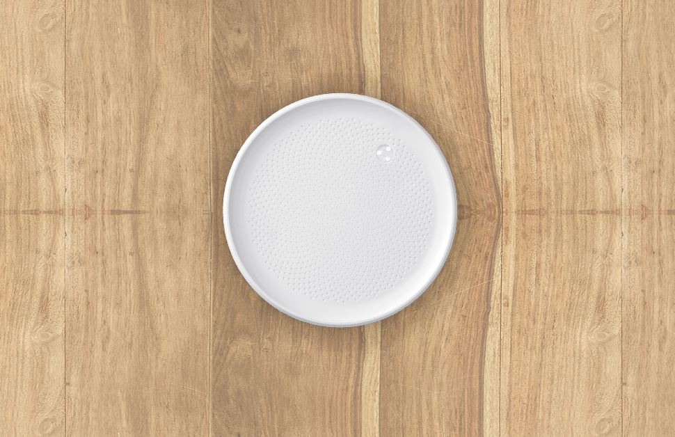 The Dodow device against a wood background.