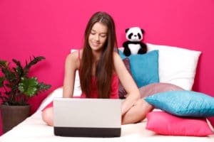 young slim woman using laptop