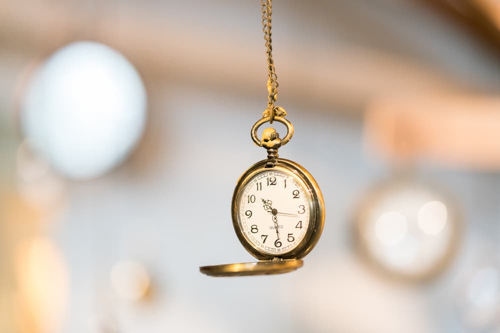 A golden stop watch used for hypnosis.