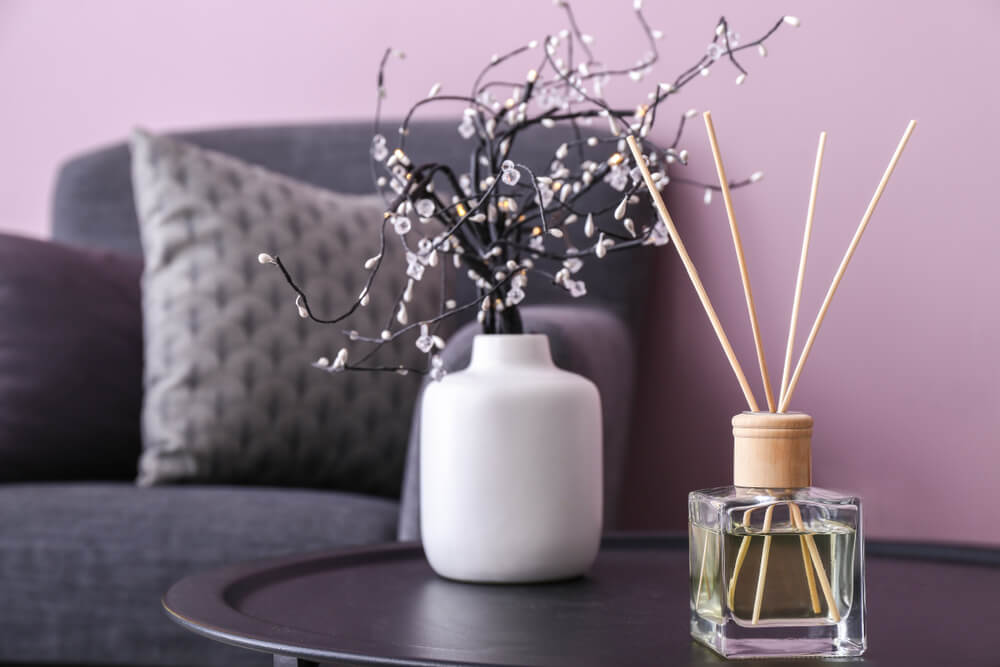 Reed diffuser on table in room
