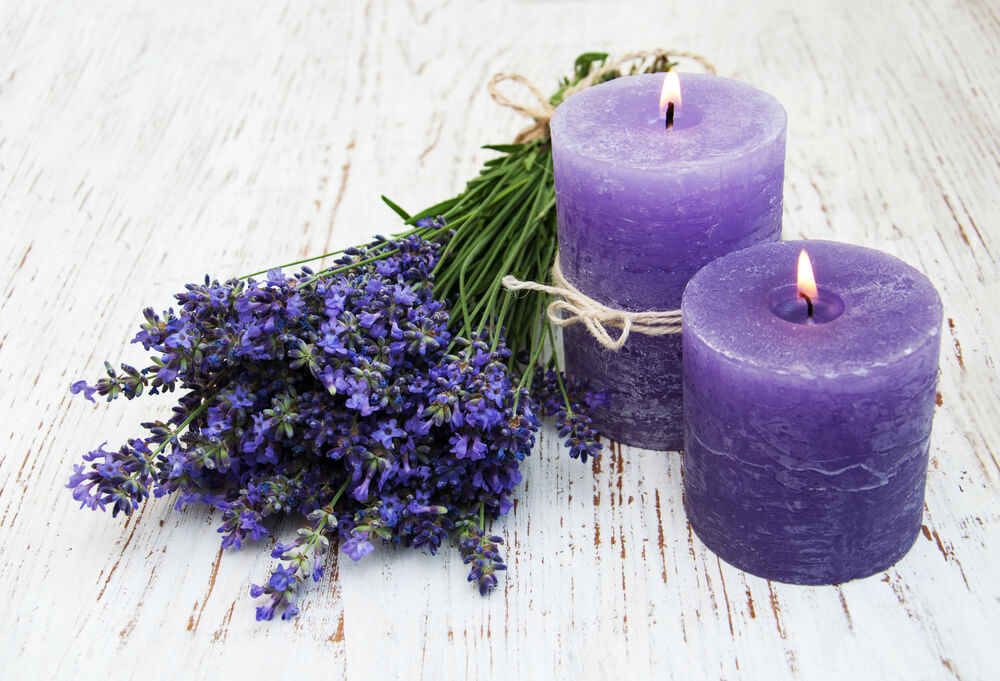 Lavender and candles on a old wooden background